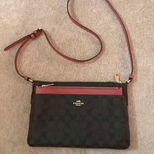 Dark brown and pink Coach cross body bag